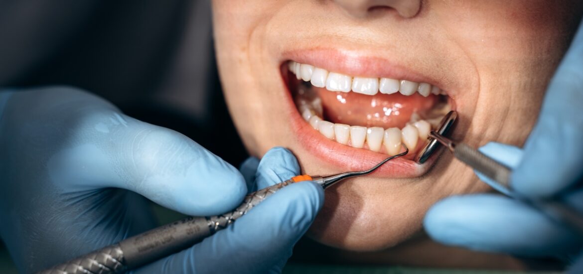Adult receiving a dental examination for common age-related dental problems